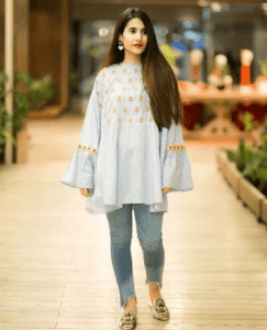 Casual Kurti with Jeans: For a laid-back and comfortable look, pair a casual kurti with jeans. Choose light and breathable fabrics for the kurti, such as cotton or linen, to ensure ease of movement. Torn or distressed jeans can add a touch of edginess to the ensemble. Complete the look with sneakers or slip-on shoes for a relaxed yet stylish appearance. Chikankari Kurta with Jeans: